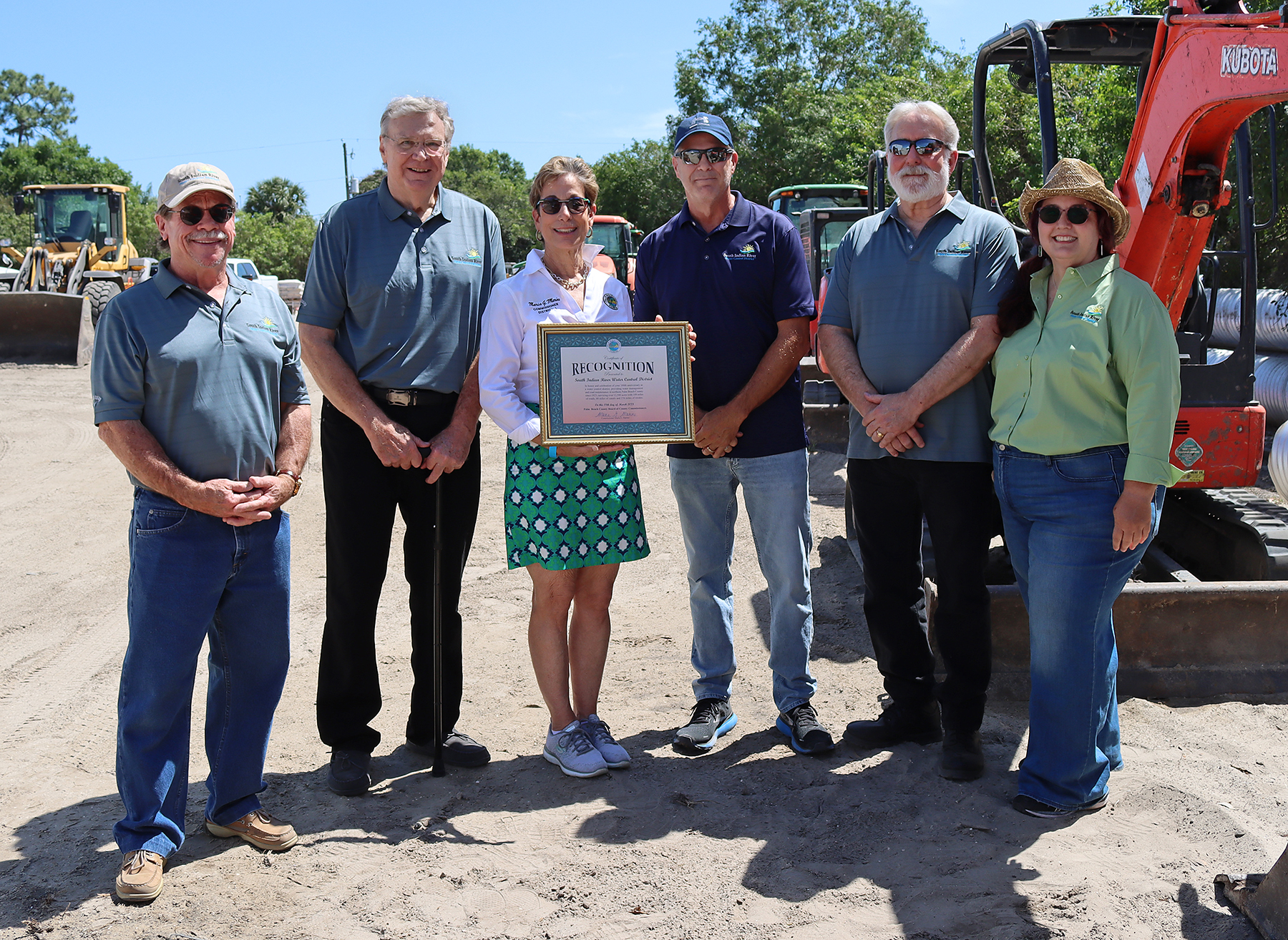 Palm Beach County Commissioner Maria Marino presents a proclamation to Board of Supervisors and Manager of Operations of South Indian River Water Control Districg